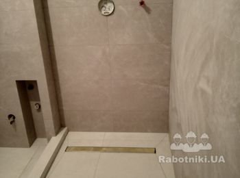 выкладка подиума под душ.кабинку, монтаж трапика, укладка плитки  с заусовкой под 45 градусов