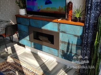 Навесной камин, который горит натуральным огнем