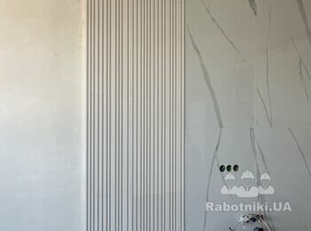 Покраска та замазка швов гипсовых панелей на стене