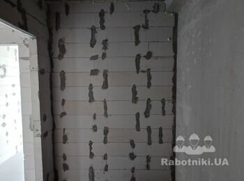 Машинна штукатурка стін.