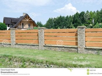 Зашить деревом пролеты каменного забора