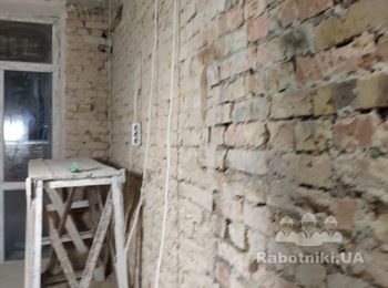 Штукатурка стен под маяки кирпичных стен