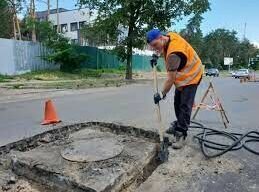 Підняття горловин оглядових (зливостічних) колодязів з асфальтуванням