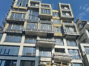 Змонтувати керамограніт на підсистему, змонтувати укоси